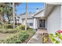 Front entrance with a walkway and landscaping at 6009 County Line Rd, Spring Hill, FL 34606