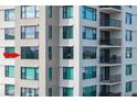 Close-up view of condo building exterior, highlighting windows and balconies at 750 Island Way # 401, Clearwater Beach, FL 33767