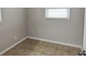 Simple bedroom with neutral walls and tile floors at 10591 116Th Ter, Largo, FL 33773