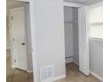 Small bedroom closet with double doors and a hanging rod at 10591 116Th Ter, Largo, FL 33773