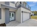 Front entrance of a two-story home with light-blue door at 11926 Riverhills Dr, Tampa, FL 33617