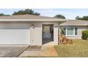 Front entrance with white door and stone accents at 13561 105Th Ave, Largo, FL 33774