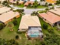 Home with pool and screened enclosure in a residential community at 16213 Diamond Bay Dr, Wimauma, FL 33598