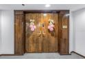 Double wood doors with pink flower accents at 1660 Gulf Blvd # 304, Clearwater Beach, FL 33767