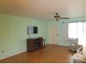 Living room with hardwood floors, fireplace, and built-in entertainment center at 1900 59Th N Ave # 212, St Petersburg, FL 33714