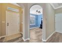 Bright and airy entryway with views into a home office at 2104 Park Crescent Drive, Land O Lakes, FL 34639