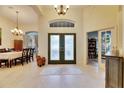 Bright and spacious foyer with a view of the dining room and living area at 2512 Centennial Falcon Dr, Valrico, FL 33596