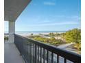 Balcony view overlooking the beach and ocean at 3200 Gulf Blvd # 204, St Pete Beach, FL 33706