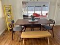 Bright dining area with mid-century modern table and chairs at 34091 Alamanda N Dr, Pinellas Park, FL 33781