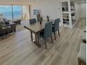 Dining area with ocean view and modern table at 450 S Gulfview Blvd # 408, Clearwater Beach, FL 33767