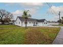 Newly renovated home with a well-manicured lawn at 4520 N Matanzas Ave, Tampa, FL 33614