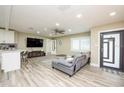 Open living area with gray sectional sofa and modern decor at 4520 N Matanzas Ave, Tampa, FL 33614