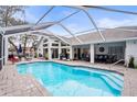 Inviting, refreshing pool with a covered patio at 8535 Delaware Dr, Weeki Wachee, FL 34607