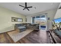 Spacious living room with L-shaped sofa and wood floors at 8967 Indigo Trail Loop, Riverview, FL 33578