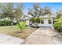 Charming house with a spacious yard and trees at 911 16Th Nw Ave, Largo, FL 33770