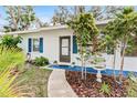 Well-maintained front yard with walkway and landscaping at 911 16Th Nw Ave, Largo, FL 33770