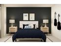 Stylish bedroom with dark walls, and guitar wall mounts at 9256 Bonita Mar Dr, Parrish, FL 34219