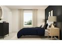 Bright bedroom with a navy blue bedspread and wood accents at 9256 Bonita Mar Dr, Parrish, FL 34219