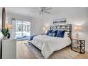 Bright bedroom with a king-size bed and access to a pool at 11624 Monette Rd, Riverview, FL 33569