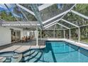 Inviting pool area with a screened enclosure and patio at 11624 Monette Rd, Riverview, FL 33569