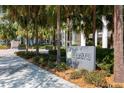 Well-manicured landscaping and elegant signage at the building entrance, surrounded by lush greenery at 145 2Nd S Ave # 616, St Petersburg, FL 33701