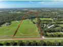 Large lot with riding arena and home at 17120 Boy Scout Rd, Odessa, FL 33556