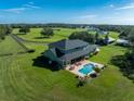 Aerial view of home with pool and expansive lot at 17120 Boy Scout Rd, Odessa, FL 33556