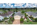 Single-story house in a golf course community near a lake at 1937 Sterling Glen Ct, Sun City Center, FL 33573