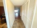 Bright condo entryway with tile flooring and built-in storage at 2284 Spanish Dr # 26, Clearwater, FL 33763