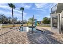 Kidney-shaped pool with a patio and a fenced yard at 3870 155Th E Ave, Parrish, FL 34219