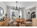 Bright dining room with wooden table and modern chandelier at 408 S Arrawana Ave # C4, Tampa, FL 33609