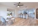 Open concept dining area with hardwood floors and kitchen access at 4702 W Bay Ave, Tampa, FL 33616