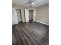 Spacious bedroom with wood-look flooring and ceiling fan at 5130 Dr Martin Luther King Jr St S, St Petersburg, FL 33705