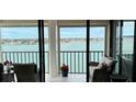 Living room with water views and access to balcony at 6265 Sun Blvd # 906, St Petersburg, FL 33715