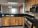 Kitchen view, showcasing stainless steel appliances and wooden cabinets at 7806 Amberlea Ct, Temple Terrace, FL 33637