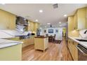 Modern kitchen with yellow cabinets and marble countertops at 830 23Rd N Ave, St Petersburg, FL 33704