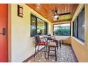 Cozy screened porch with seating area, perfect for relaxing at 830 23Rd N Ave, St Petersburg, FL 33704