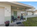 Inviting front porch with two chairs, perfect for relaxing at 960 43Rd Ne Ave, St Petersburg, FL 33703