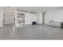 Spacious living room with terrazzo floors and built-in shelving at 960 43Rd Ne Ave, St Petersburg, FL 33703