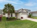 Well-maintained one-story house with a lush green lawn at 16732 Mooner Plank Cir, Wimauma, FL 33598