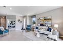 Open living area with tiled floors and modern furnishings at 18141 Cropside Trl, Lakewood Ranch, FL 34211