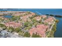 Aerial view of waterfront community with lush landscaping at 2724 Via Murano # 631, Clearwater, FL 33764