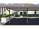 Condo carport with parking spaces and landscaping at 2866 Countrybrook Dr # 15, Palm Harbor, FL 34684