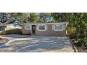 Charming single story home with a gravel driveway at 301 3Rd Sw Ave, Largo, FL 33770
