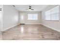 Bright living room with hardwood floors and neutral walls at 3409 E Comanche Ave, Tampa, FL 33610