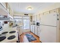 Bright kitchen with ample counter space and wood cabinets at 35138 Dale Ave, Zephyrhills, FL 33541