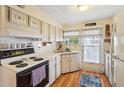 Cozy kitchen featuring wood cabinets and modern appliances at 35138 Dale Ave, Zephyrhills, FL 33541
