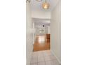Bright and airy entryway with tiled floors leading to a living area at 4746 Azalea Dr # 203C, New Port Richey, FL 34652