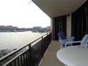 Relaxing balcony with water views, and patio furniture at 690 Island Way # 802, Clearwater Beach, FL 33767