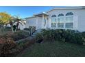 Gray manufactured home with palm trees and walkway at 8512 Fantasia Park Way, Riverview, FL 33578